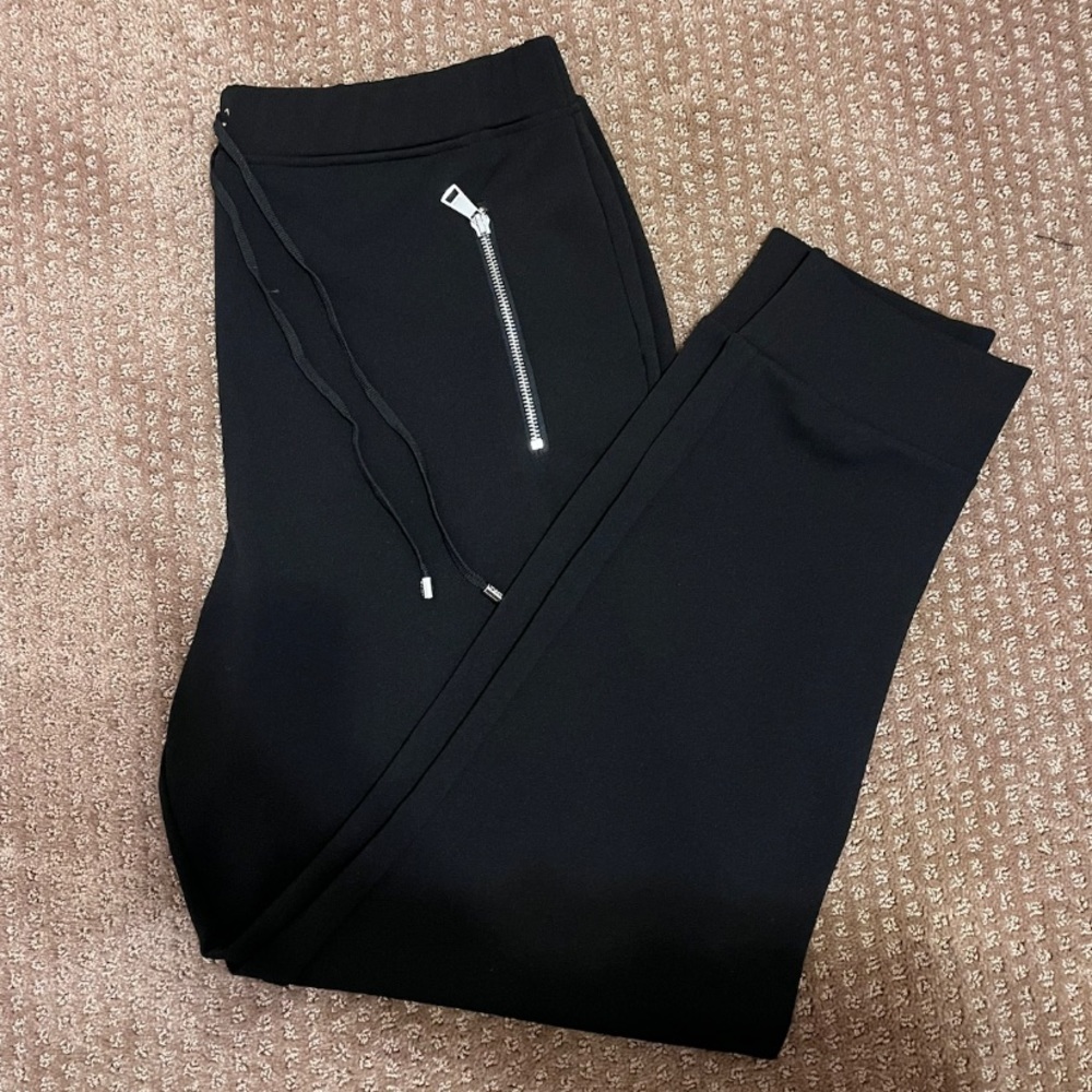 DKNY: Black Jogger Pant, Size L, with two zipper pockets on the side.
